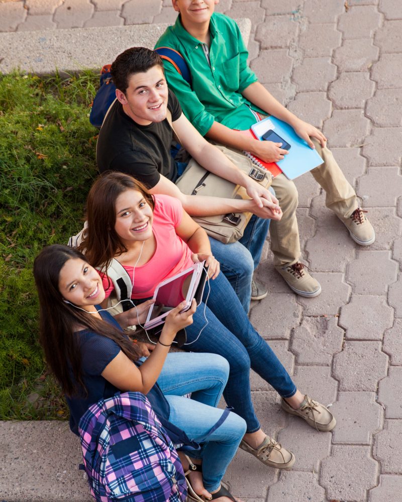 High angle view of a group of high school friends hanging out after class